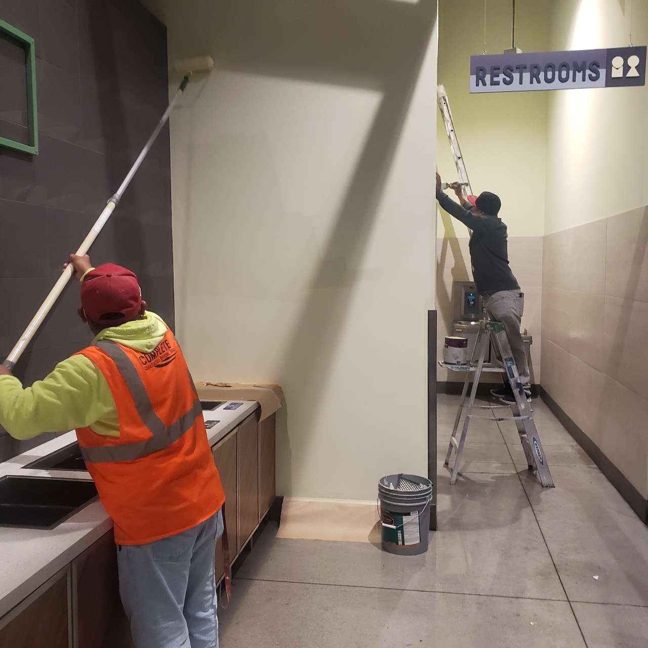 people remodeling a commercial restroom